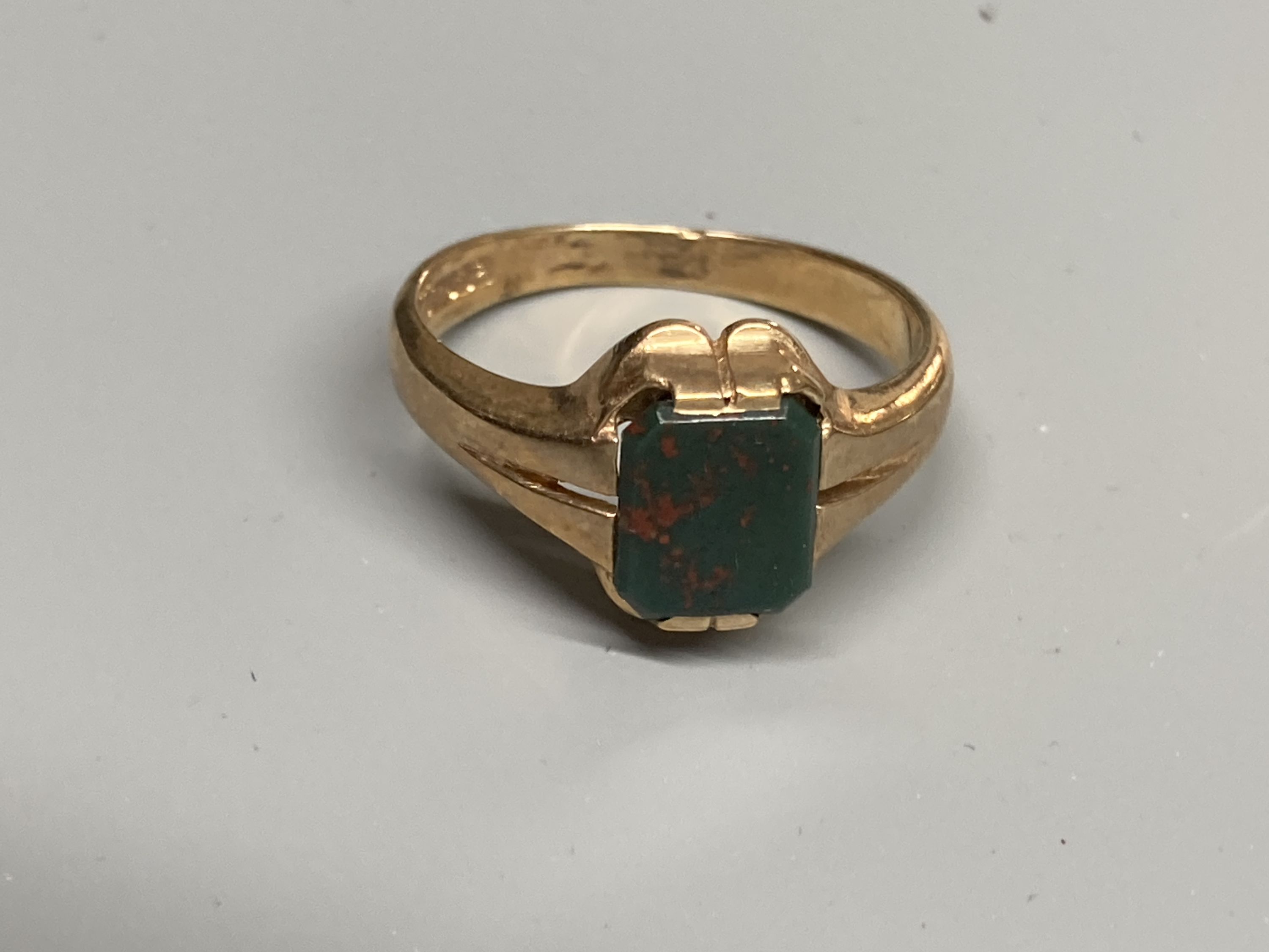 Two modern 9ct gold and bloodstone set signet rings, sizes M & T and a 9ct gold and hematite ring, size S/T